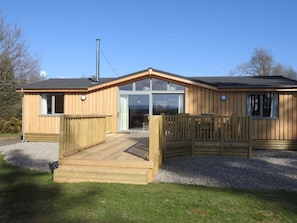 Patio doors leading to decking and garden