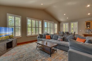 Living area with comfy sofa, flat screen tv, and fireplace