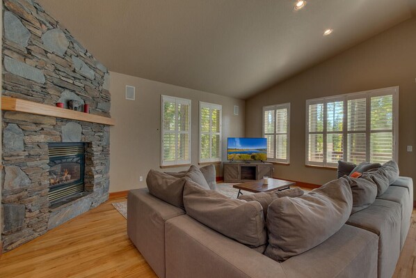 Living area with comfy sofa, flat screen tv, and fireplace