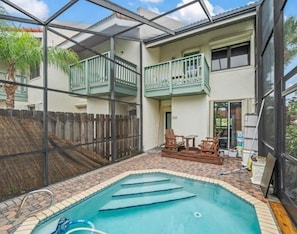 personal pool and 2 story screen room for guests of this one townhouse