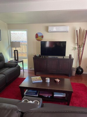 Large sectional sofa with 3 recliners.  Smart TV and AC/Heat.