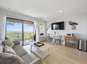 Wall mounted TV with cable.
Dinning area for breakfast and coffee.