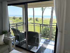 Best view! Sit on the patio and enjoy the beach and sounds of the waves.