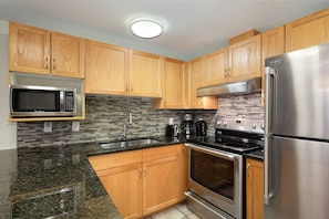 Fully equipped kitchen with stainless steel appliances