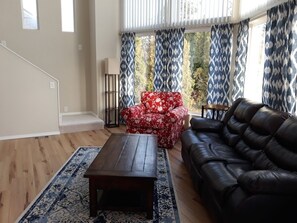 Living room with recling leather  couch.