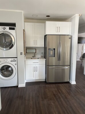 New full size washer and dryer and large refrigerator 