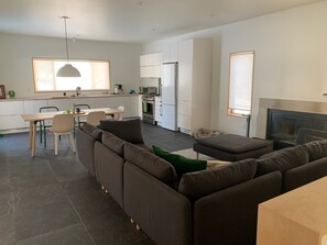 The kitchen has a large window overlooking the patio, and wildflower hill.