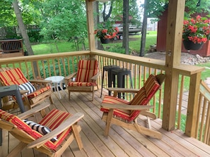 Relax on the back porch is chair or bar stool with wide plank to use as bar.