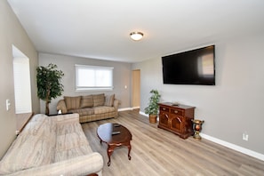 Spacious living area with 60" smart TV
