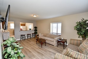 Spacious living area with 60" smart TV
