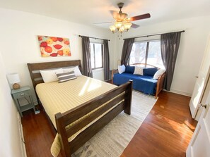 The comfortable queen bed is accompanied by a plush twin with a trundle.