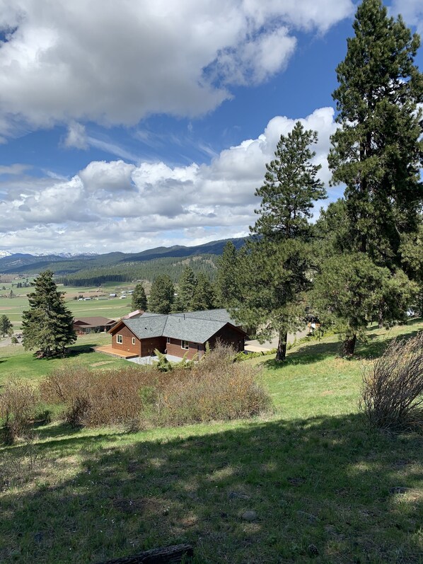 Privately Looking down over the home from the east and up on the hill. 