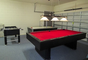 Games room includes pool table and foosball table for you to enjoy.