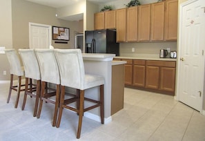 Kitchen breakfast bar for additional dining seating.