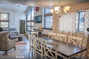 Vaulted ceilings with large windows add natural light to the unit.