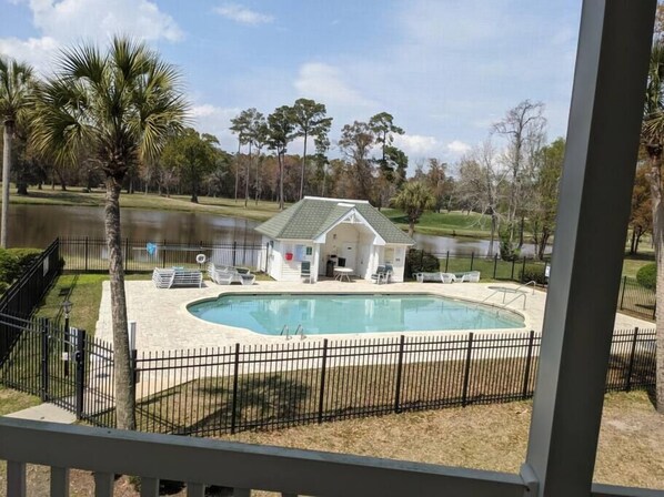 Balcony overlooking outdoor communal pool