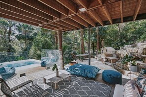 The sweeping outdoor space with pool, fire pit, hammock and wood oven. 