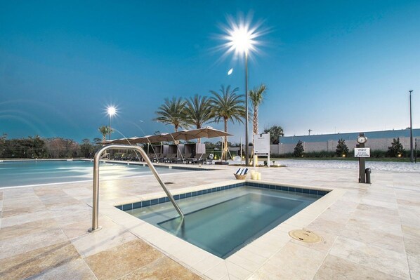 Swimming pool with loungers and umbrellas