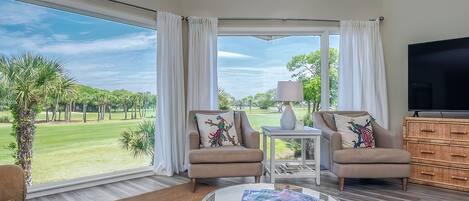 Beautiful floor to ceiling windows give you panoramic views of Crooked Oaks golf course.