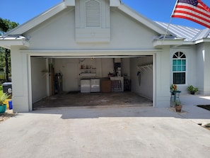 Electric hurricane strength garage for your cars and entry thru the kitchen.