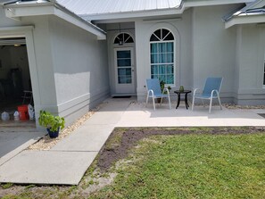 Either enter the house from the front door off the patio or through garage.