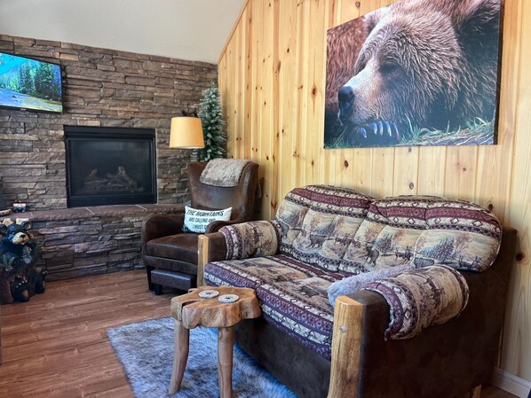 Cozy up next to the fireplace as you gaze out the window views….🥰