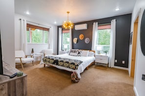 Luxury master bedroom (BR #1) with views of river and wilderness