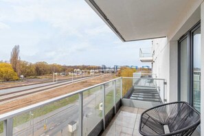 Relax on the balcony's comfortable chairs and enjoy the fresh air.