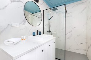 Clean and contemporary, the bathroom offers a relaxing space.