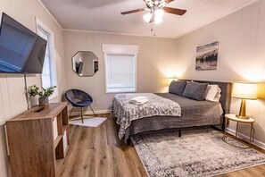 Bedroom 1 with queen bed and Smart TV