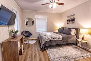 Bedroom 1 with queen bed and Smart TV