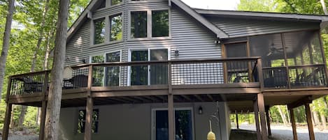 Beautiful Chalet windows, deck, and screened in porch overlooking serene woods