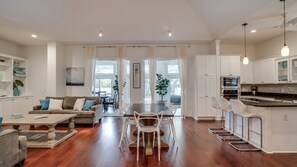 Breezy living. Dining, kitchen, and living roomBreezy living. Dining, kitchen, and living room