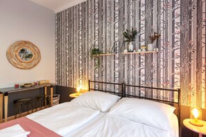 Pink room with kingsize bed and ensuite bathroom