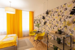 Yellow room with kingsize bed and ensuite bathroom