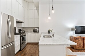 Kitchen area with additional bar seating 