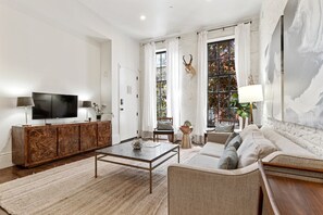 Beautiful living room space equipped with TV perfect for Netflix 