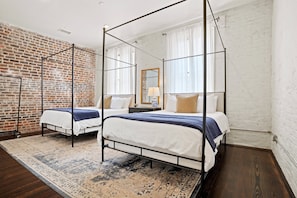 Huge bedroom with two queen beds perfect for groups and ensuite bathroom