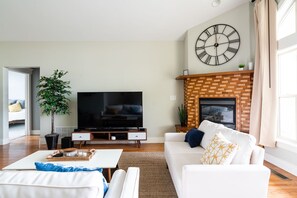Large flat screen great for a movie night or cozy up around the gas fireplace.