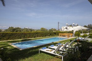 Luxurious and private garden area with a large private pool and sea views