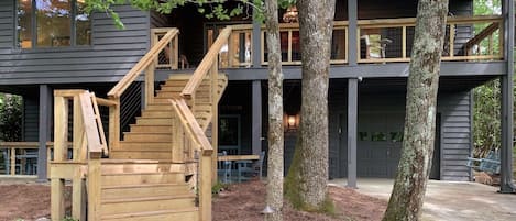 Entertainment spaces include covered porches, large deck, & moss covered yards