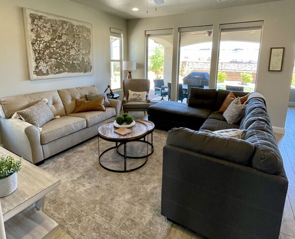 Comfy and relaxing family room invites gathering.  Large HD Smart TV.