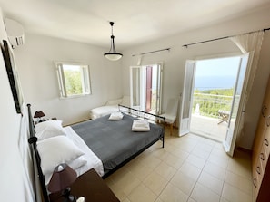 Bedroom 1 - wake up overlooking the sea and have coffee on the balcony
