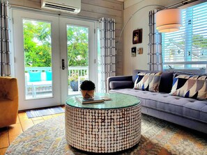 French doors from the Living room lead to a private back deck seating area.