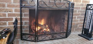 Warm yourself by the fire when it is cold out.