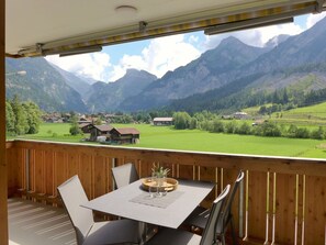 Sky, Cloud, Table, Mountain, Property, Porch, Nature, Building, Plant, Wood