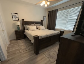 Master bedroom with king bed and walk in closet