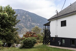 Photo Taken from parking pad, showing your amazing lake view, and large yard.