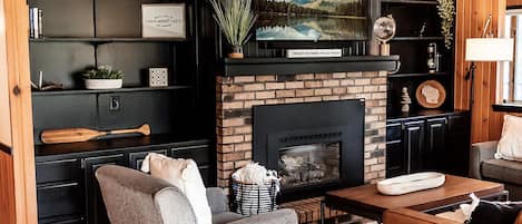 Living room with Smart T.V. and gas fireplace