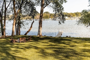 Large back yard with private fire pit and dock